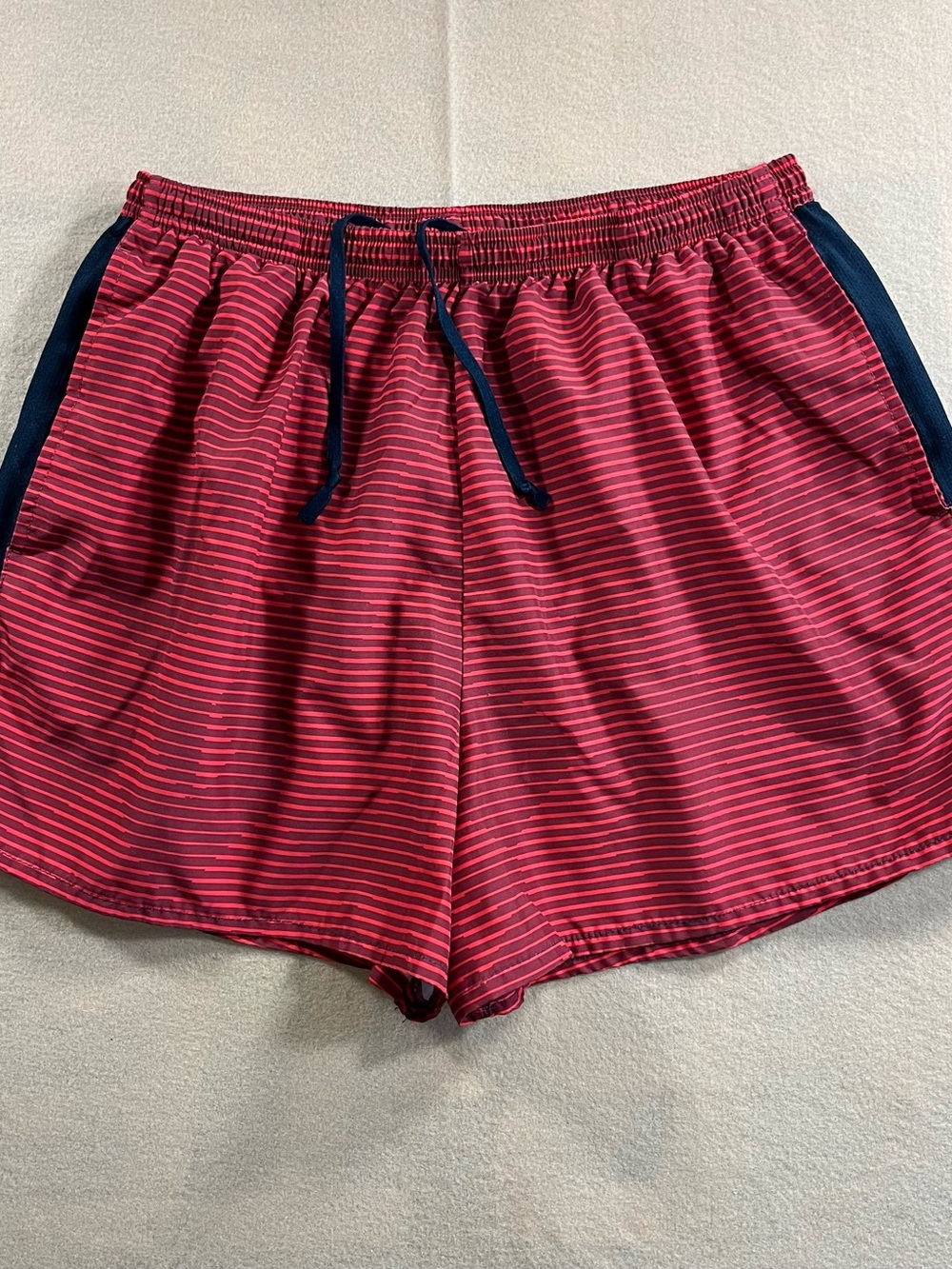 Nike Women’s Red Striped Athletic Shorts with Black Accents